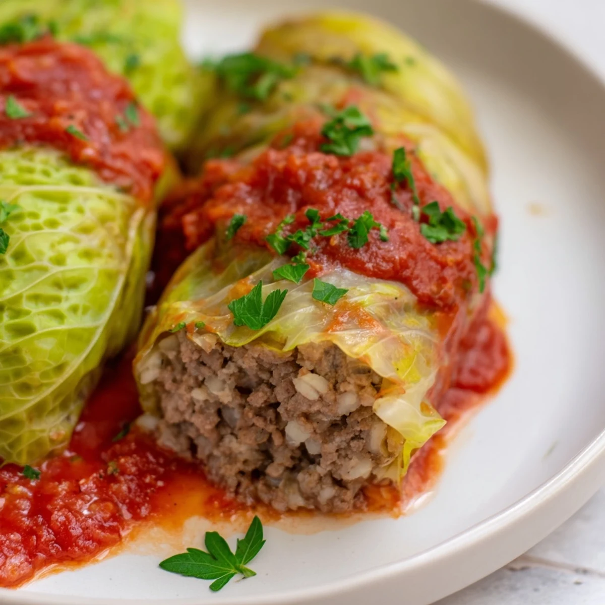 Simple Gołąbki bathed in tomato sauce, a classic Polish comfort food.