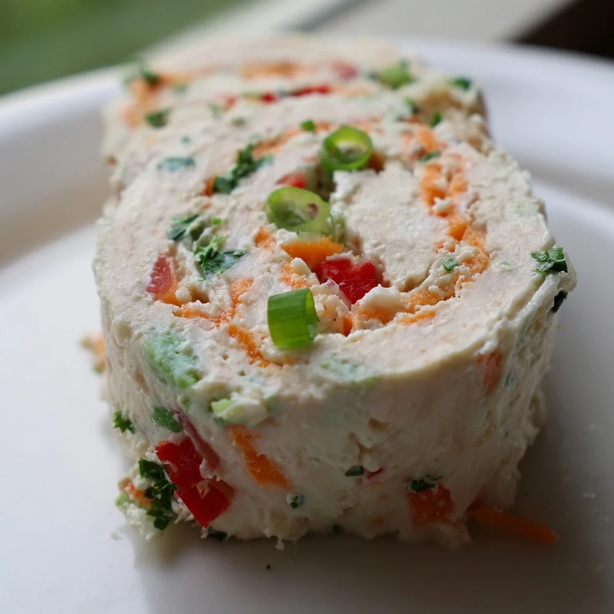 Cozy Scarf Holiday Pinwheel Wraps arranged beautifully on a platter, showcasing colorful veggie fillings.