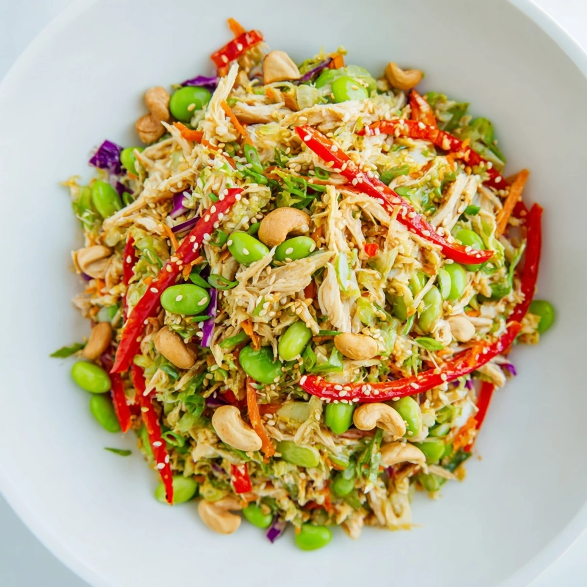 Edamame Crunch Chicken Salad: a refreshing bowl filled with colorful vegetables and tender chicken.