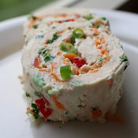 Cozy Scarf Holiday Pinwheel Wraps arranged beautifully on a platter, showcasing colorful veggie fillings.
