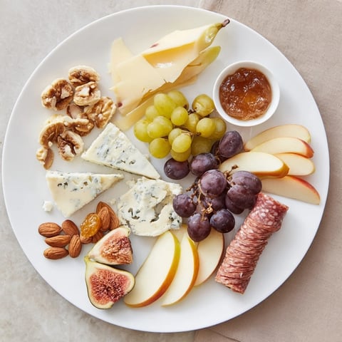 A beautiful Wine & Food Pairing Platter, filled with gourmet cheeses and seasonal fruits.