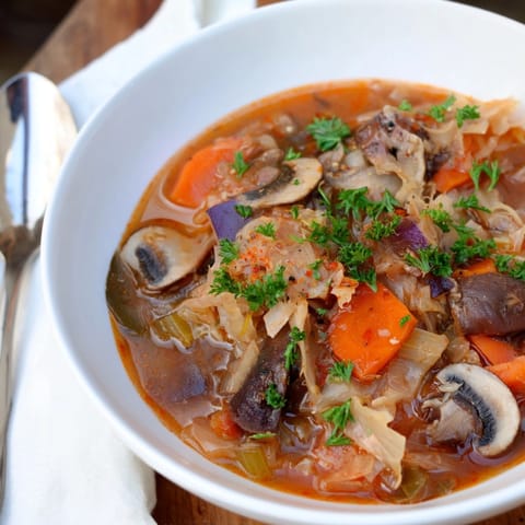 Earthy Sauerkraut and Mushroom Hunter’s Stew, fragrant with paprika, ready for a cozy supper.