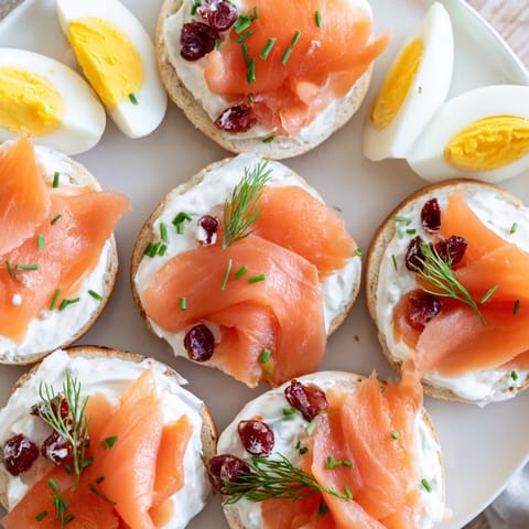 Festive cranberry sleigh bagel board adorned with smoked salmon, fresh fruit, and colorful toppings.