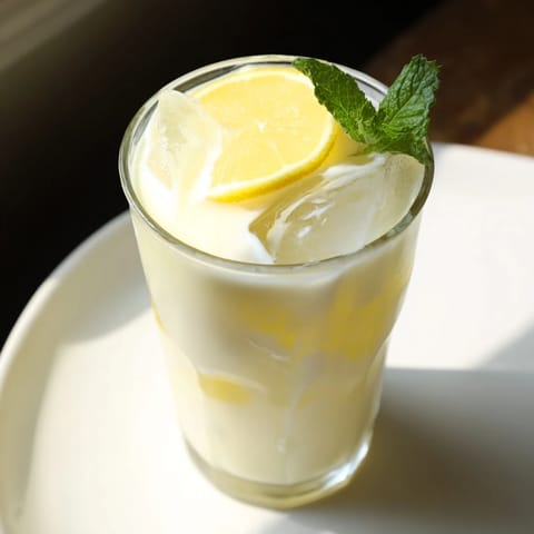 Refreshing, tangy creamy lemonade with ice, a cool drink perfect for a hot afternoon.