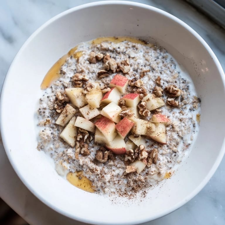 Creamy Overnight Oats with Apples, Cinnamon, and Honey: a delicious breakfast with sweet honey.
