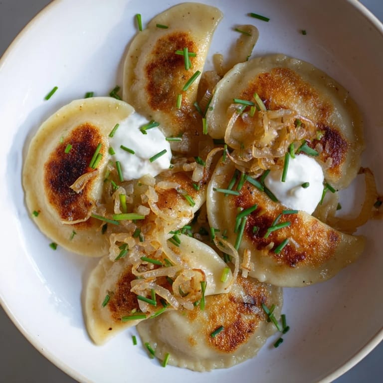 Savory Authentic Potato and Cheese Pierogi Ruskie, tender and delicious dumplings, perfect for a family dinner.