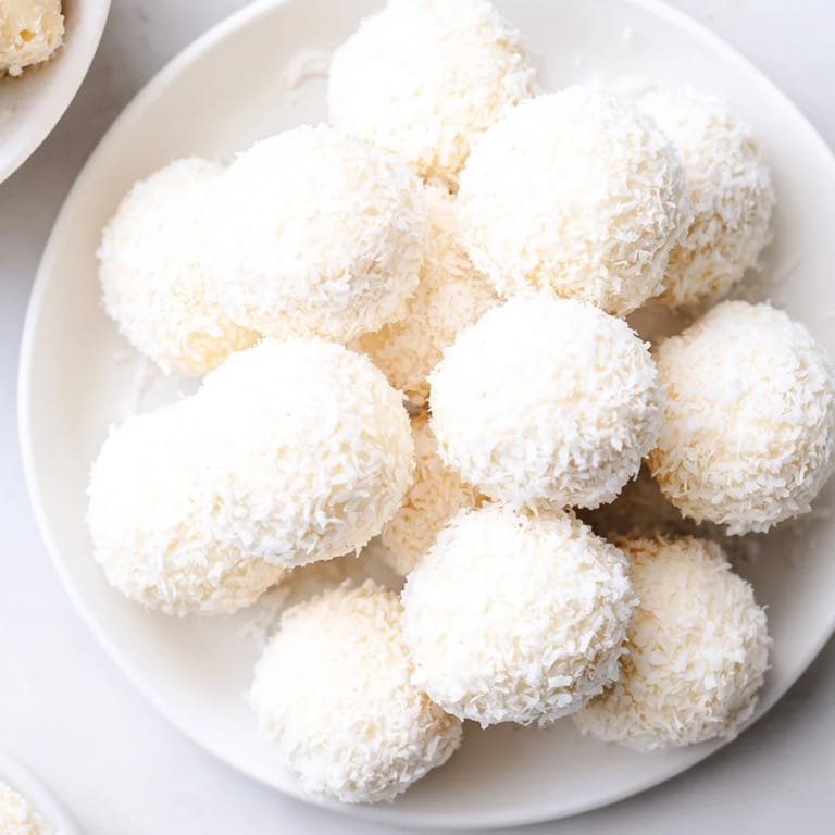 Sweet, coconut-covered Marshmallow Snowball Dip, a delightful platter for a party, ready to dip.