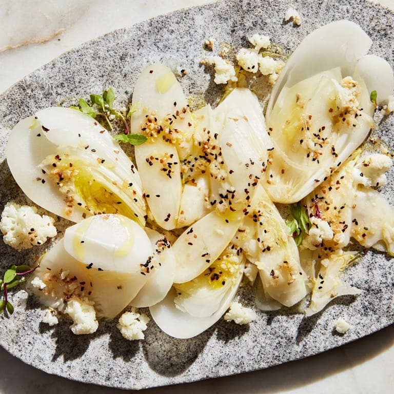 Crisp, cold vegetables artfully arranged as The Tundra Trek, perfect for a light vegetarian meal.