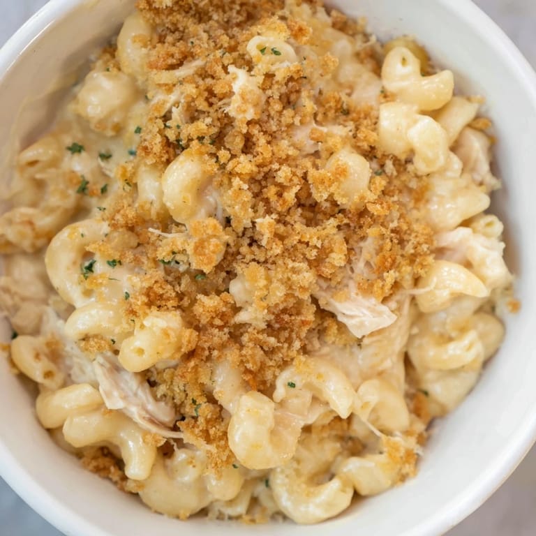 Creamy, homemade cheese sauce coats the tender Struggle Meal Chicken Macaroni with canned chicken.