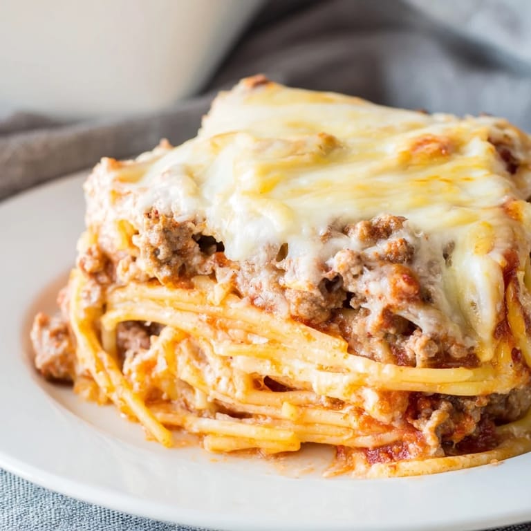 Close-up of baked Million Dollar Spaghetti: a hearty Italian-American comfort food classic.