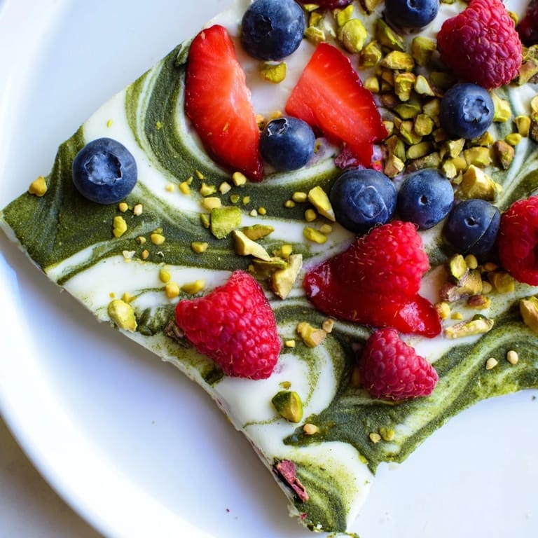 Vibrant close-up of swirled Frozen Yogurt Bark, a healthy and delicious frozen treat.