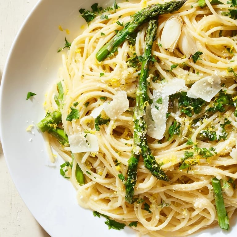 Freshly made Roasted Garlic & Asparagus Pasta with Parmesan cheese, ready to be enjoyed.