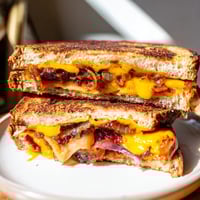 Golden, crusty Bacon Jam Grilled Cheese oozing melted cheese, a rich, savory sandwich to savor.